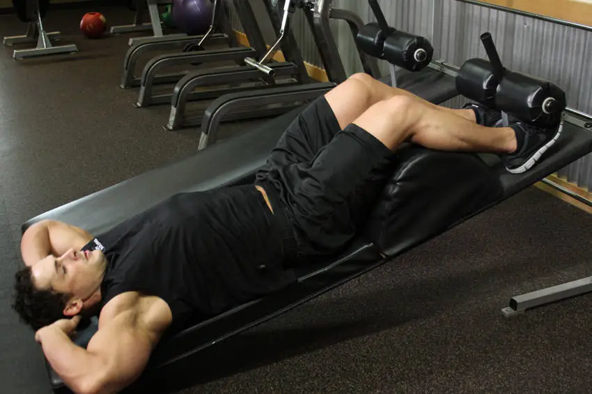 Gravity-Boosted Belly Squeeze (Slanted Torso Curl)